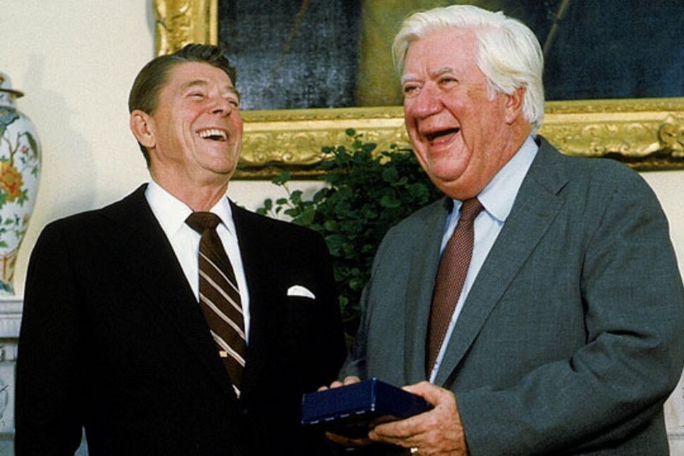 Ronald Reagan and Tip O'Neill laughing together in the White House
